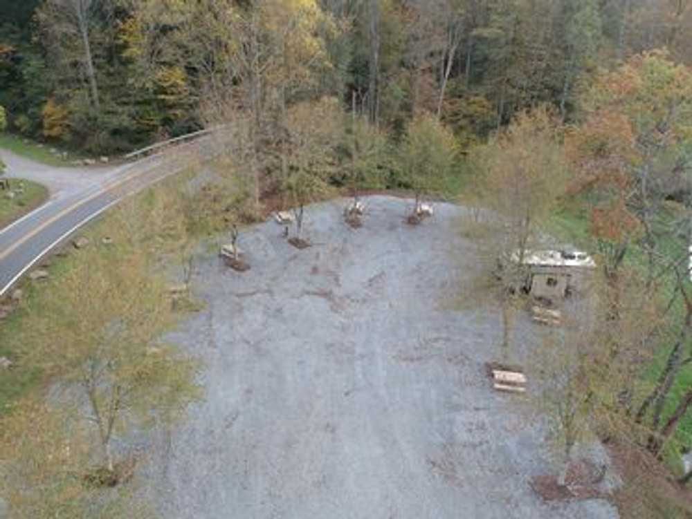 Aerial view of partial hookup RV sites in the forest – Partial Hookup RV Site at The Outpost NRG