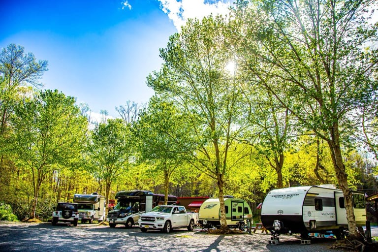 Row of RVs and travel trailers parked at the partial hookup sites – Partial Hookup RV Site at The Outpost NRG
