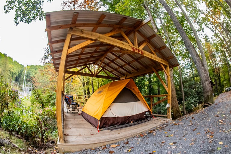 Elevated tent platform patio in the trees – Tent Platforms at The Outpost NRG