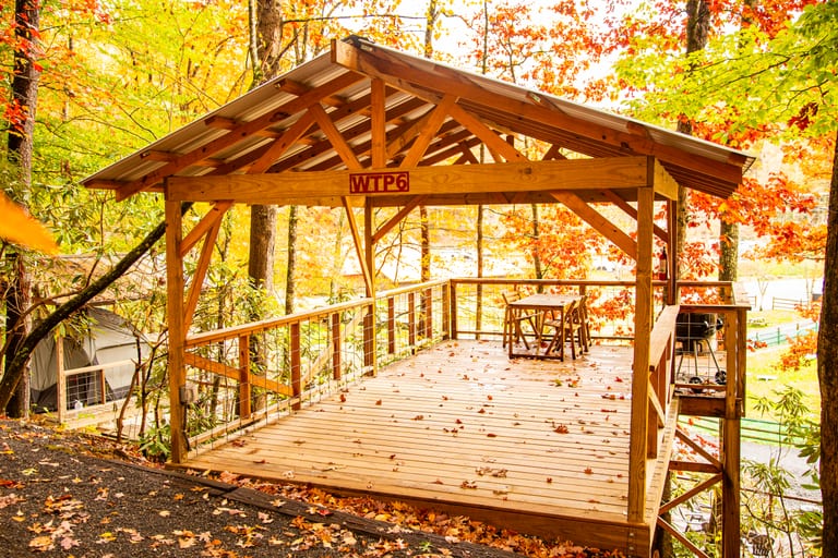 Table and chairs on a tent platform deck – Tent Platforms at The Outpost NRG